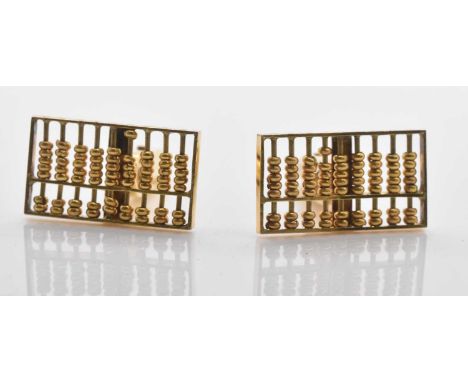 A pair of yellow metal cufflinks, each designed as an abacus, stamped '14K', combined approx 6.6g.