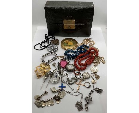 A group of costume jewellery including coral coloured beads, simulated pearls, a silver fob watch, pendant on chain, blue ena