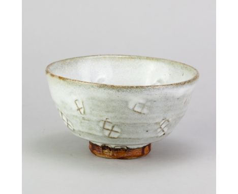 JIM MALONE (born 1946); a stoneware chawan covered in white glaze with impressed decoration, impressed JM and A (for Ainstabl