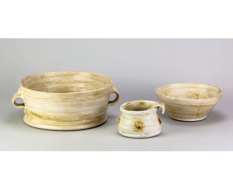 JONATHAN ROBERTS; a stoneware twin handled dish washed in pale green ash glaze, diameter 27cm, and a matching bowl, pot and l