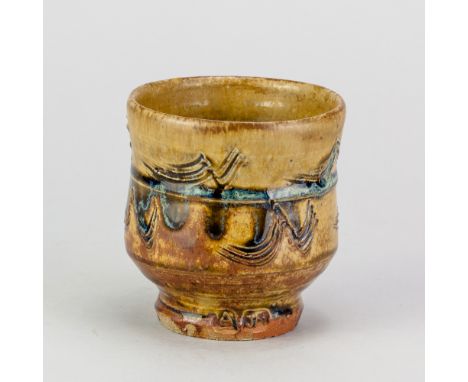 JIM MALONE (born 1946); a stoneware yunomi covered in green ash glaze with incised decoration picked out in copper blue, impr