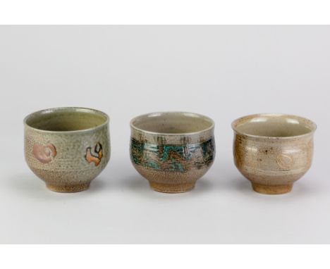 RAY FINCH (1914-2012) for Winchcombe Pottery; three salt glazed teabowls with different decoration, impressed WP. marks, tall