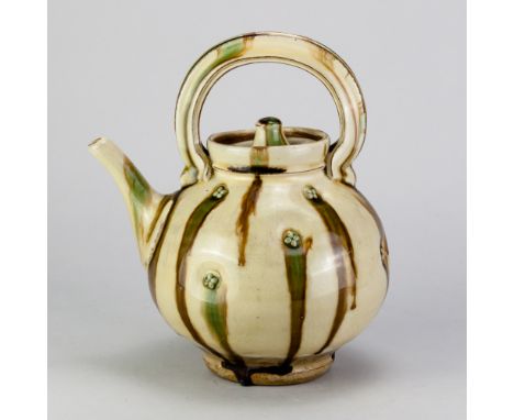 TAKESHI YASUDA (born 1943); a stoneware teapot covered in sansai glaze with impressed button decoration, height 24cm.Provenan