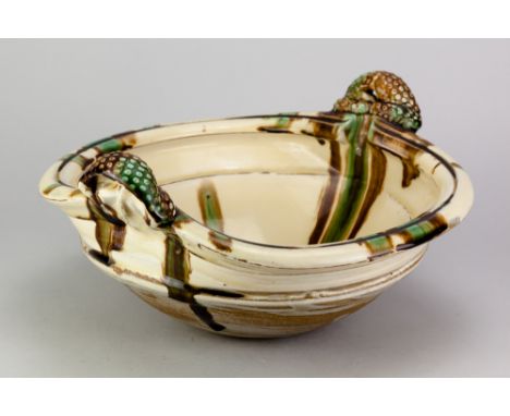 TAKESHI YASUDA (born 1943); a large stoneware twin handled 'sprung bottom bowl' covered in sansai glaze, diameter 33cm.Proven