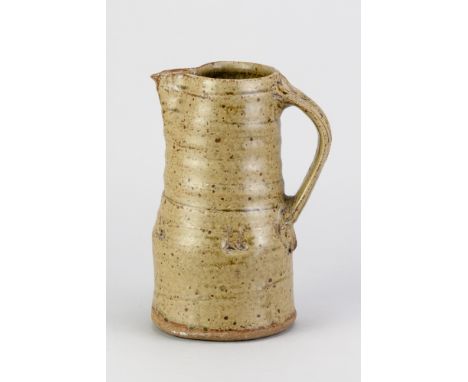 JIM MALONE (born 1946); a stoneware jug covered in green ash glaze, impressed JM mark, height 22cm. (D)Additional Information