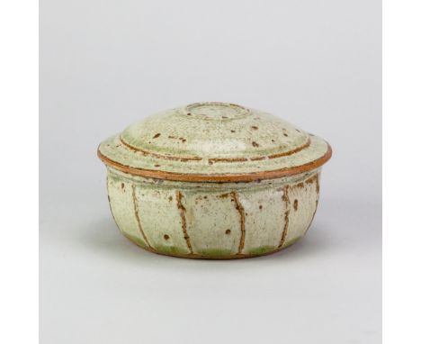 RICHARD BATTERHAM (1936-2021); a stoneware cut sided butter dish covered in green ash glaze, diameter 14cm. (D)Provenance: Pu