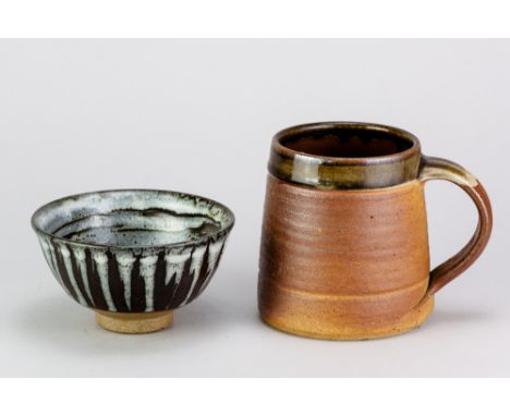 JOHN LEACH (1939-2021) for Muchelney Pottery; a small stoneware bowl covered in white and tenmoku glaze forming a swirling pa