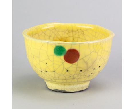 HORST KERSTAN (1941-2005); a raku bowl covered in pitted yellow crackle glaze with copper red and green spots, impressed K ma
