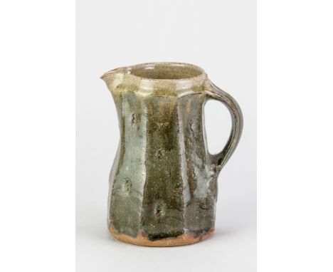 JIM MALONE (born 1946); a stoneware faceted jug covered in sea green ash glaze, impressed JM and A (for Ainstable) marks, hei