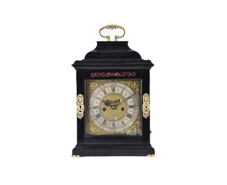 A George I/II ebonized twin fusee repeat chiming table clock, The inverted bell top case with a well-cast swing handle and so