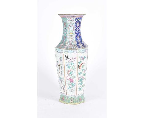 A Chinese porcelain octagonal vase, Qing, 19th century, painted in the famille rose palette, the waisted neck with panels of 