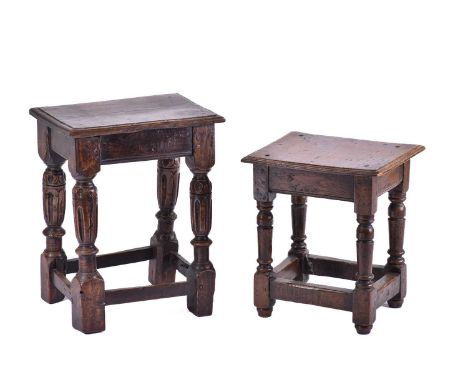 A Jacobean style oak joint stool with thumb moulded top over carved, slender cup and cover spindles united by stretchers. 41 