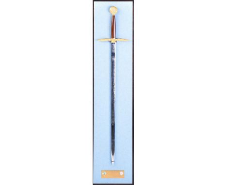 A Wilkinson Sword "Battle of Britain" limited edition 65/300 commemorative sword. With etched blade and spread eagle gilt bro