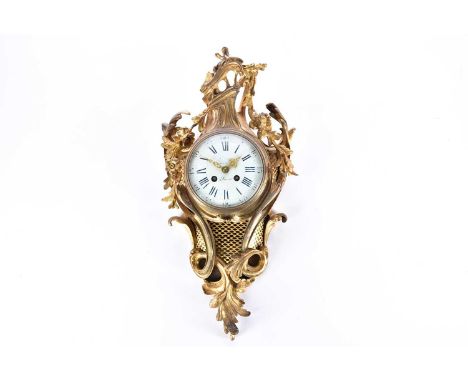 A French gilt bronze cartel clock, late 19th century, the movement by Samuel Marti &amp; Co, chiming on a bell, the enamel di