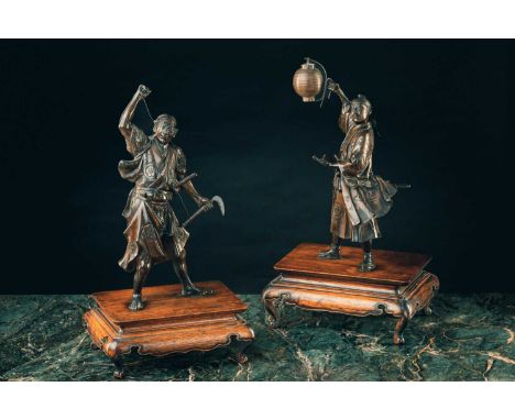 Two Japanese bronze okimono of samurai, Meiji period, signed Akasofu Gyoko, cast as a signalman holding aloft a lantern and a