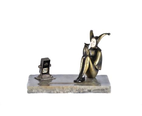 Attributed to Roland Paris (1894 - 1945), a cold painted bronze and ivory figure, circa 1930, modelled as a seated jester rep