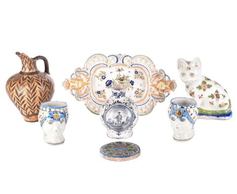 A collection of seven items of continental ceramics including a delftware vase, faience ware cat, and a Desvres dish. Dimensi