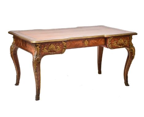 A French Louis XV style rococo marquetry and Kingwood bureau plat of inverted breakfront form, late 19th century. The top wit