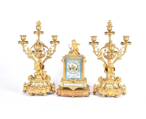 A matched gilt metal clock garniture, 19th century, each with Paris porcelain panels, the clock with eight day Japy Frere mov