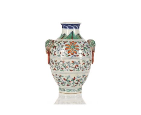 A Chinese porcelain Doucai vase, possibly republic period, the shoulder painted with leaves above light aubergine elephant ma