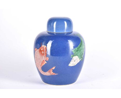 A Chinese powder blue ginger jar &amp; cover, in the Kangxi style, painted with four fish to the body and a further fish on t