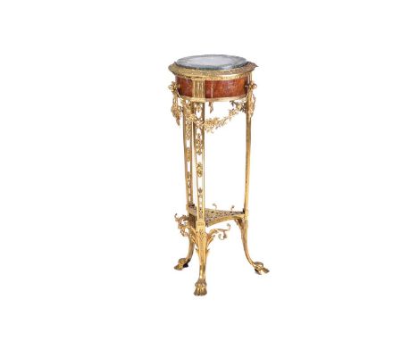 A Louis XVI style marble-topped gilt bronze and mahogany circular gueridon, late 19th century, with swags and faux tassels, t