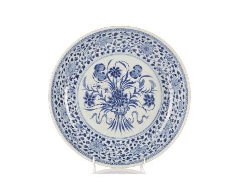 A Chinese blue &amp; white lotus bouquet dished charger, in the Ming style, the central bouquet within a scrolling lotus bord