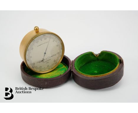 An early 20th century gilt brass circular pocket barometer altimeter, the dial with outer altitude scale, detailed Negretti &