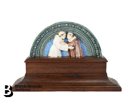 After Andrea della Robbia majolica plaque, depicting the embrace of St Francis & St. Dominic approx 42 w x 26 cms, surmounted