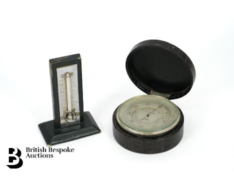 Edward VIII Asprey London Compensated Aneroid barometer, 80mm circular silvered dial combined with a curved thermometer signe