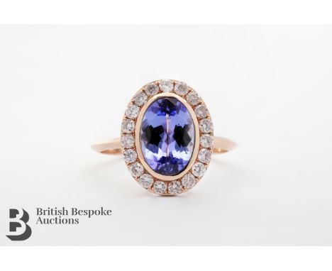 14ct Rose gold natural, intense violet tanzanite and diamond ring. The ring set with an oval tanzanite 2.08 cts, surrounded b