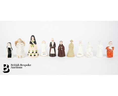 Collection of antique porcelain candle extinguishers, 19th century, including Chinese scholar, praying figure, nun in black r