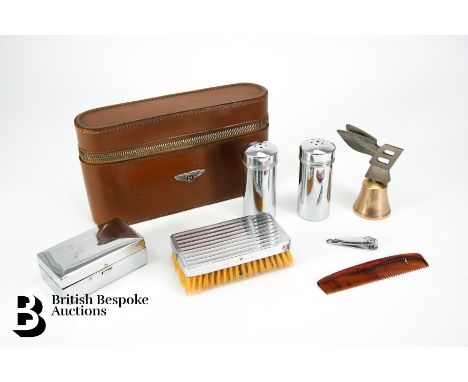 A vintage leather travelling grooming set for the vintage and classic Bentley owner, containing hairbrush, bakelite and chrom