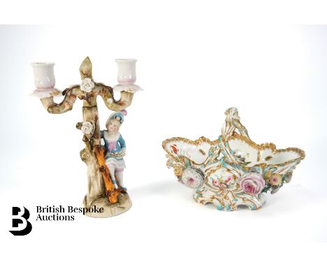 An early 19th century Coalport flower encrusted bon bon basket, with flower heads in relief, the interior of the bowl hand pa