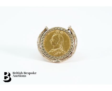 A 1887 Queen Victoria full gold sovereign, in a 9ct gold ring mount, gross weight 14 gms.&nbsp;Condition ReportSplit to ring.