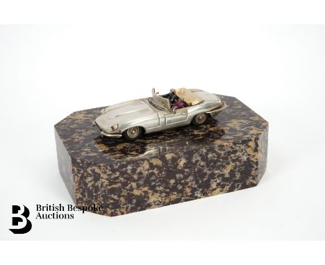 A silver bespoke model E-Type Jaguar convertible, hand crafted by Gordon Yates, with two enamel figures inside, diamond and r