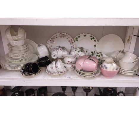 A shelf of assorted tea/dinner sets including Colcough