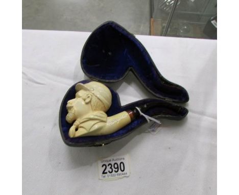 A cased Meerschaum pipe with bowl depicting a 19th century Ameican soldier with crossed rifles to Kepi.