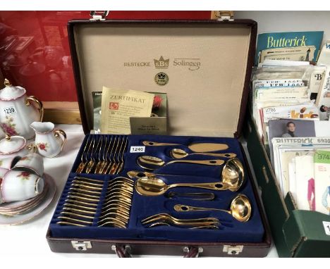 A Bestecke Solingen gold plated &amp; blue enamel canteen of cutlery