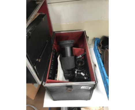 A Pentax MX camera, flash &amp; 4 lenses including telephoto