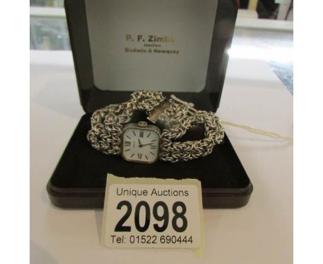 A Tissot ladies dress watch with silver bracelet strap.