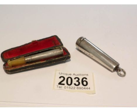 A cased silver and pale amber cheroot/cigarette holder (hall marked Francis Webb, Birmingham 1917) together with a 9ct gold a