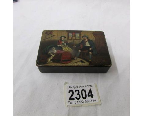 A snuff box with continental scene.