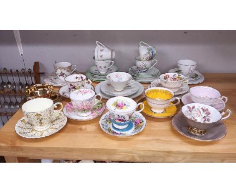 A mixed lot of porcelain cups and saucers including Paragon, Royal Doulton etc.,