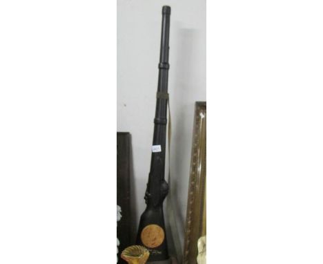 A black ceramic rifle.