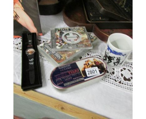 A collection of Take That collectables including CD, Video, watch, ceramic box and mug.