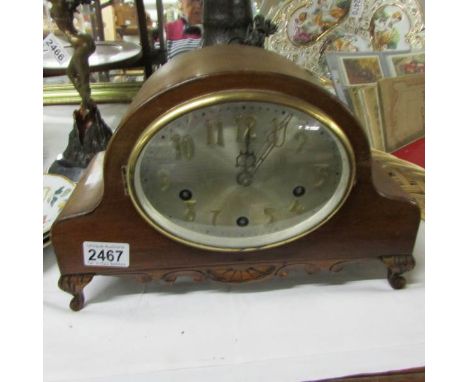 A Westminster chime mantel clock with key.