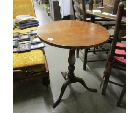 An oak tripod table.