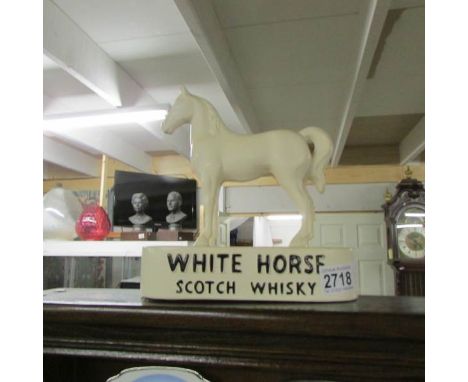 A White Horse Scotch Whisky advertising horse figure.