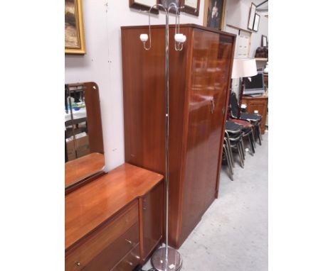 A chrome standard standard lamp
